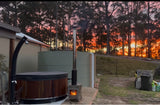 Ember woodfired plunge pool and hot tub setup at sunset on an off-grid property.